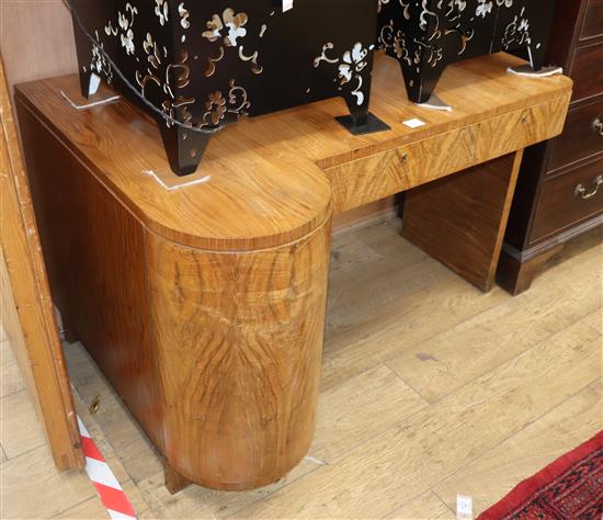 An Art Deco walnut kneehole dressing table W.120cm
